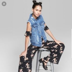 Black flowered jumpsuit with arm cuffs